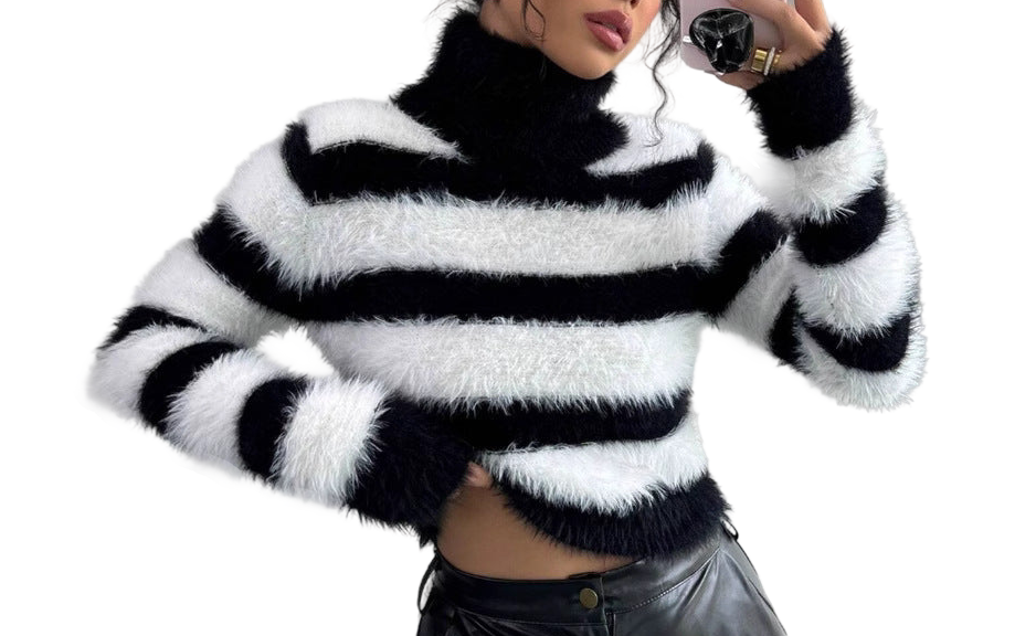 a woman in a black and white striped sweater taking a selfie